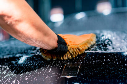 Clean and spotless car interior with pristine leather seats, a dust-free dashboard, and vacuumed carpets after detailing in Roswell, GA.