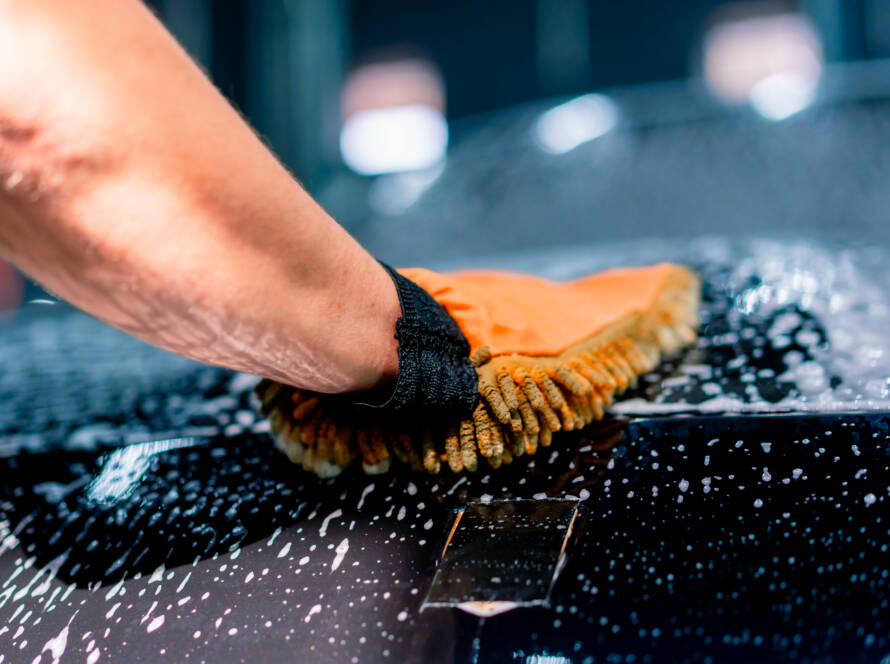 Clean and spotless car interior with pristine leather seats, a dust-free dashboard, and vacuumed carpets after detailing in Roswell, GA.