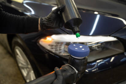 A before-and-after photo of a car's engine bay, showcasing the dramatic transformation after detailing.