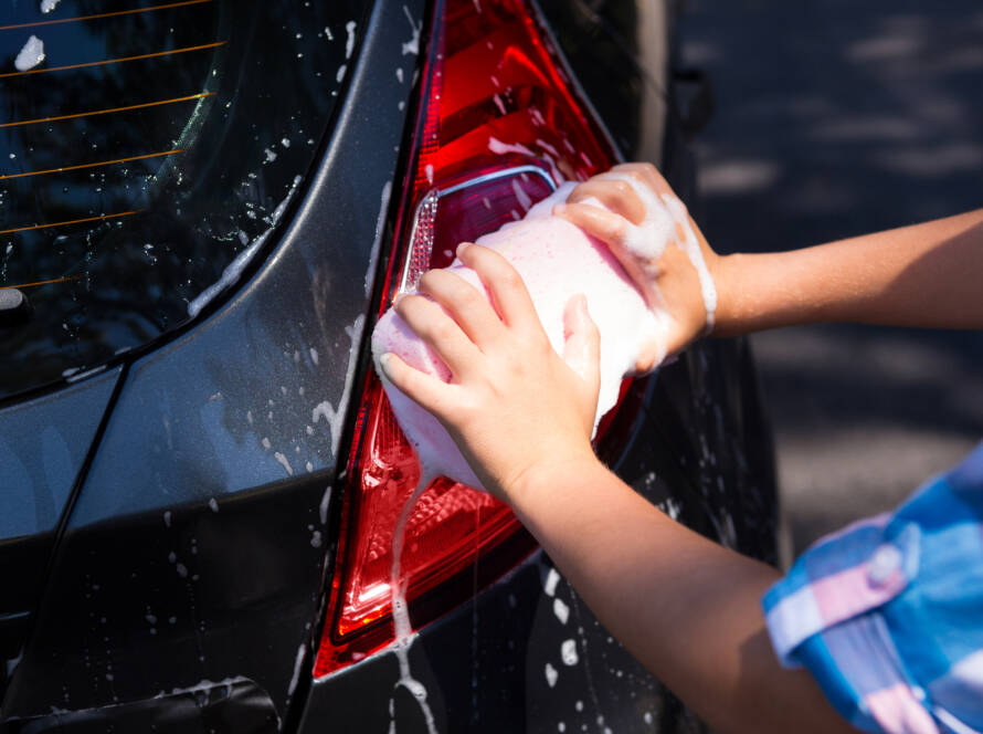 Close-up of a car panel before and after paint correction, showcasing the removal of swirl marks and scratches.