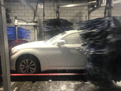 Before-and-after photo of a damaged wheel with curb rash being repaired at 85AutoSpa in Roswell.