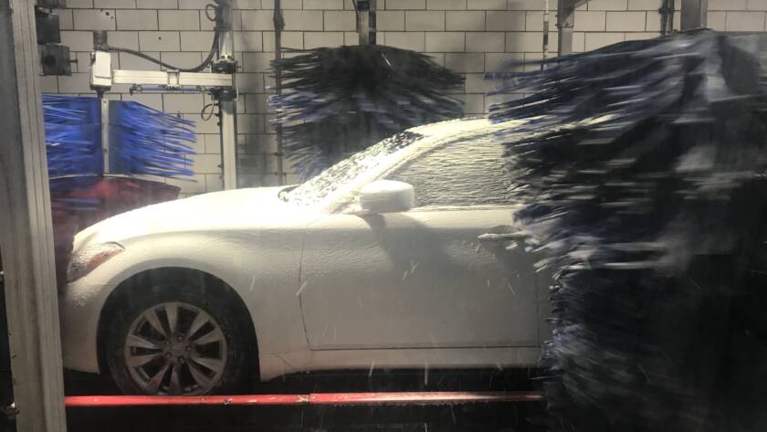 Before-and-after photo of a damaged wheel with curb rash being repaired at 85AutoSpa in Roswell.