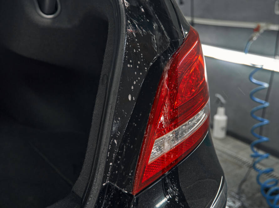 Before-and-after photo of a car's headlights, showcasing the dramatic improvement in clarity after restoration.