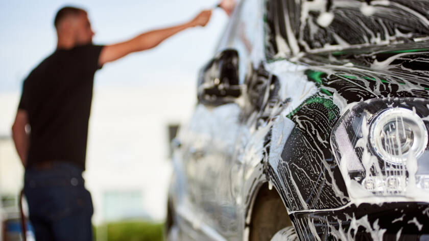 A luxury car being meticulously detailed by 85AutoSpa technicians.