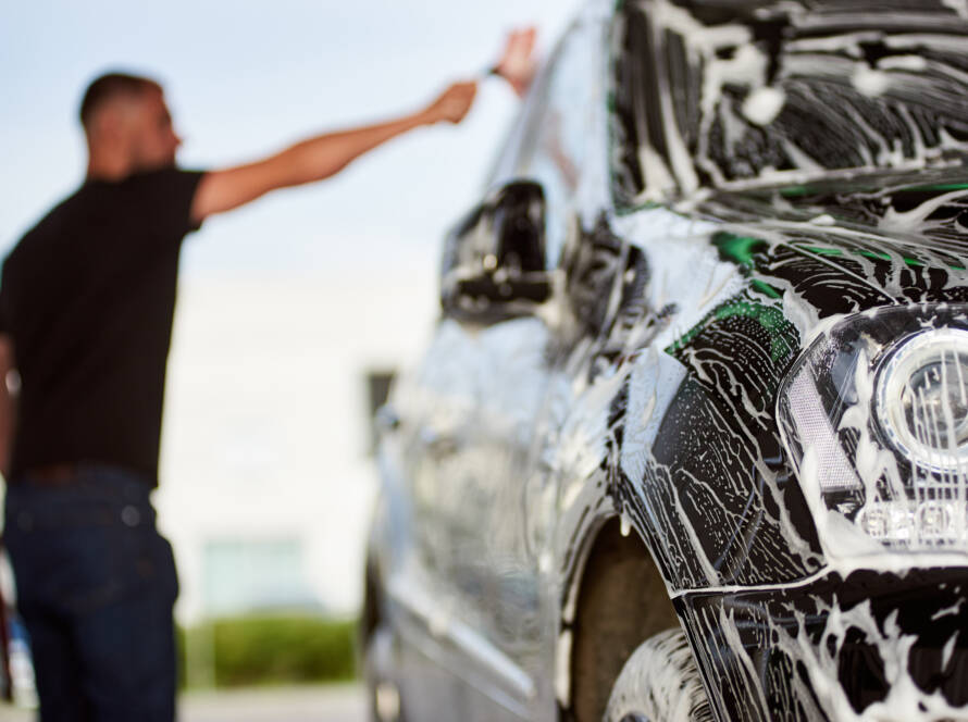 A luxury car being meticulously detailed by 85AutoSpa technicians.